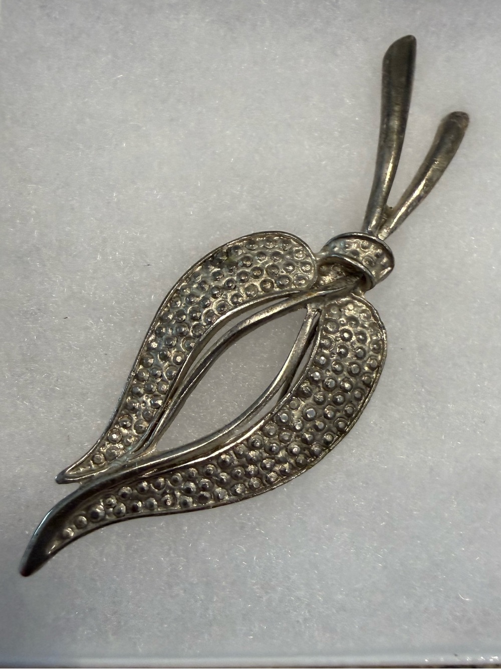 Silver tone quiet luxury hammered metal swirled brooch avant garde  pin up